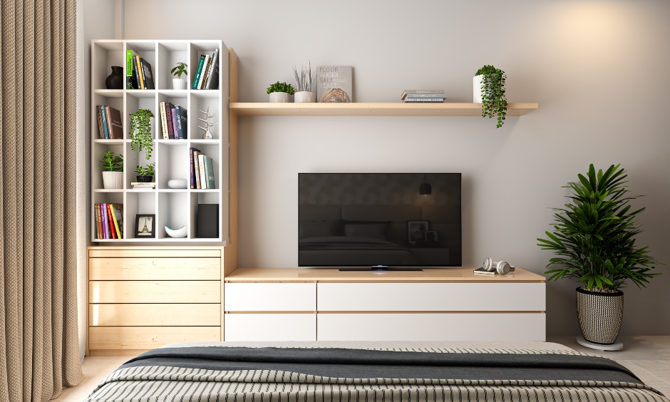 1bhk flat tv unit and book cabinet in the bedroom