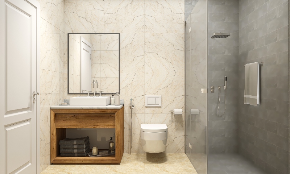 2bhk home interior design in the master bathroom is designed with light coloured wall tiles