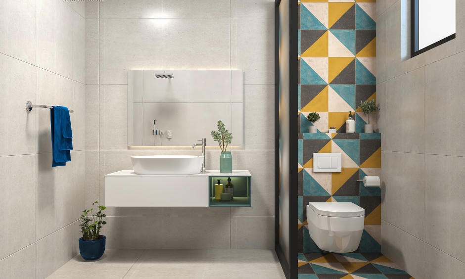 2bhk house interior design where the guest bathroom has a colourful tiled wall for a pop of colour and fun