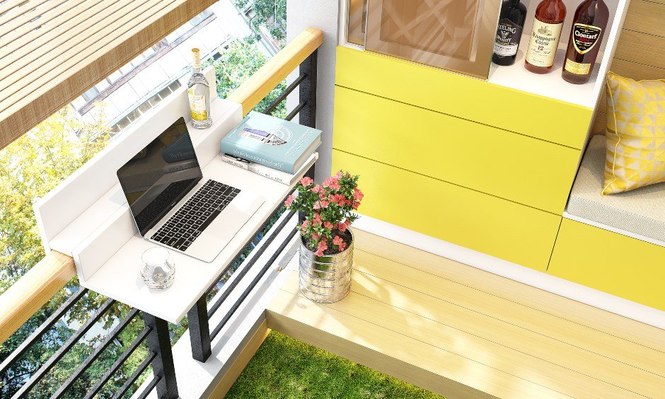 House balcony design with counter attached to railing used as a study table