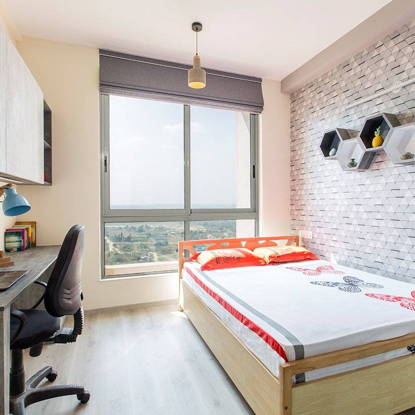 Bedroom wall design by opting for geometric patterned wallpaper and shelves for any room wall design