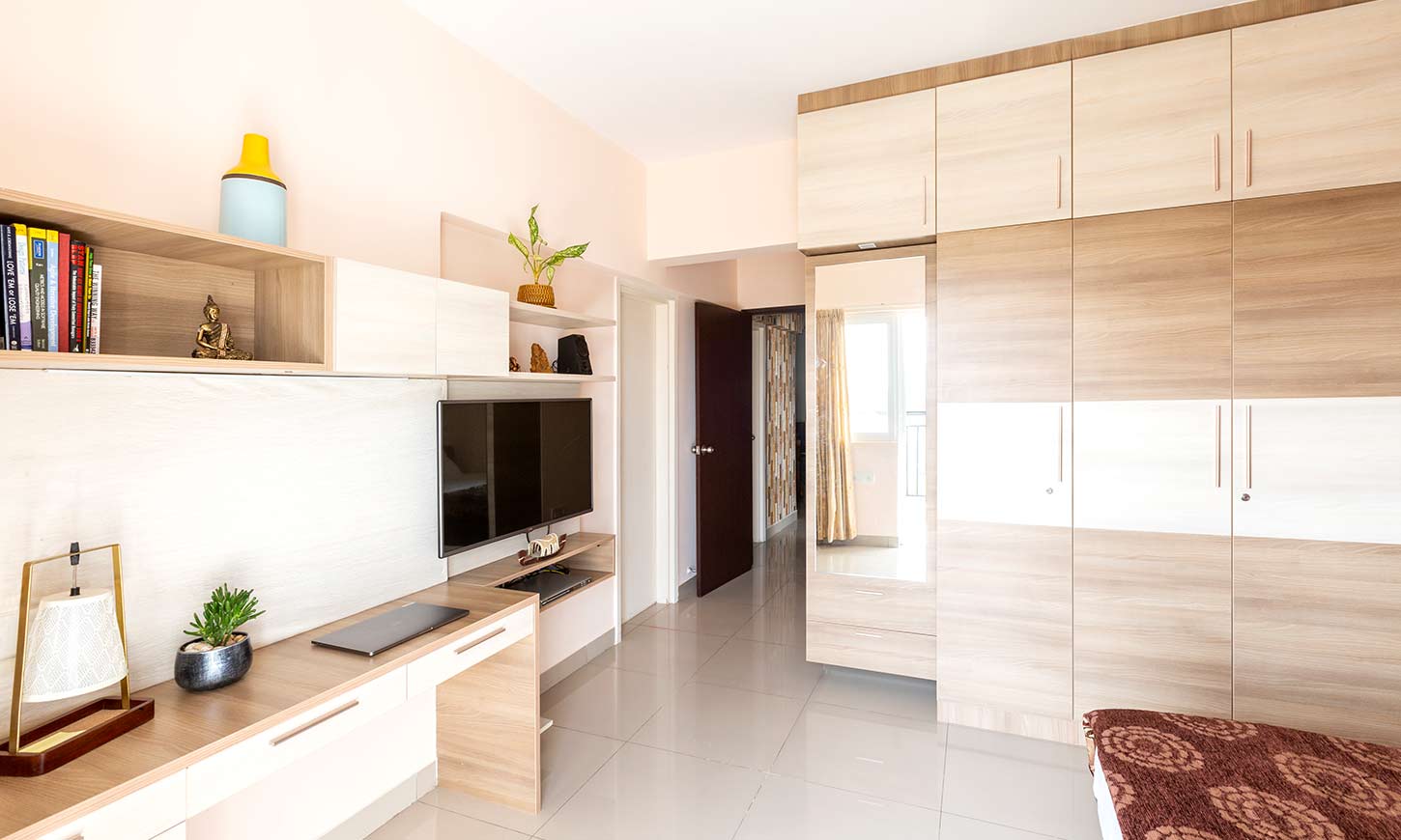 Bedroom with cupboard designed by best home interiors bangalore