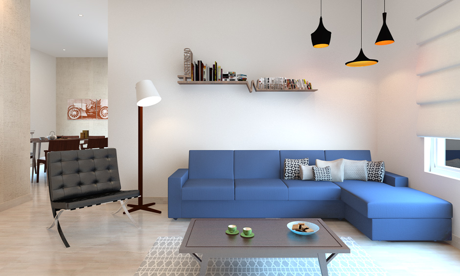 Blue sofa enhances decor with its vibrant hue, offering style and comfort in any living space