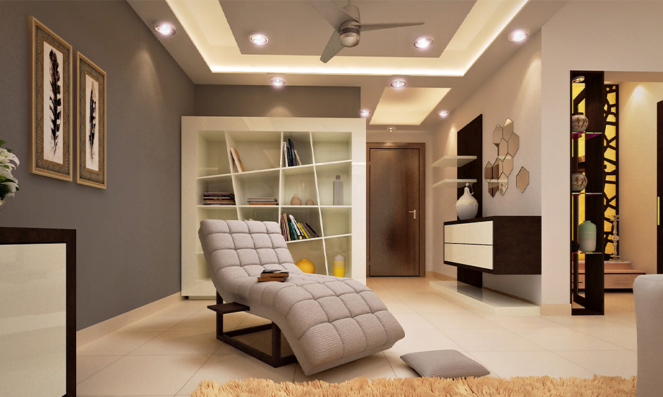 Rectangular hall with a layered false ceiling design and soft lighting, creating symmetry and a spacious, elegant ambience.