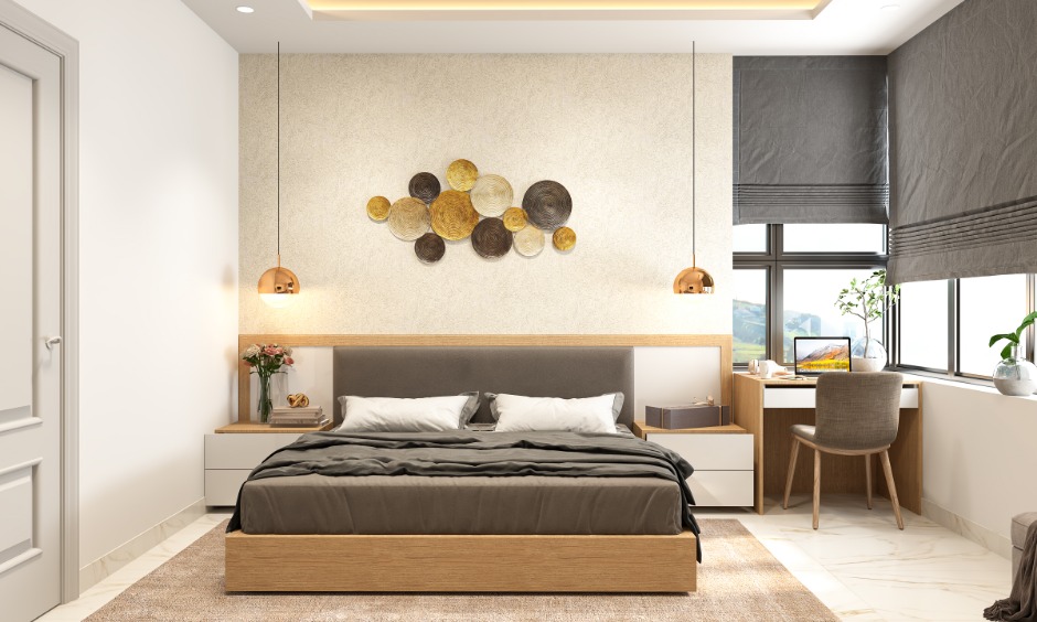 A classy bedroom in 1 bhk home design with a bed and a small study nook gives the interior edge