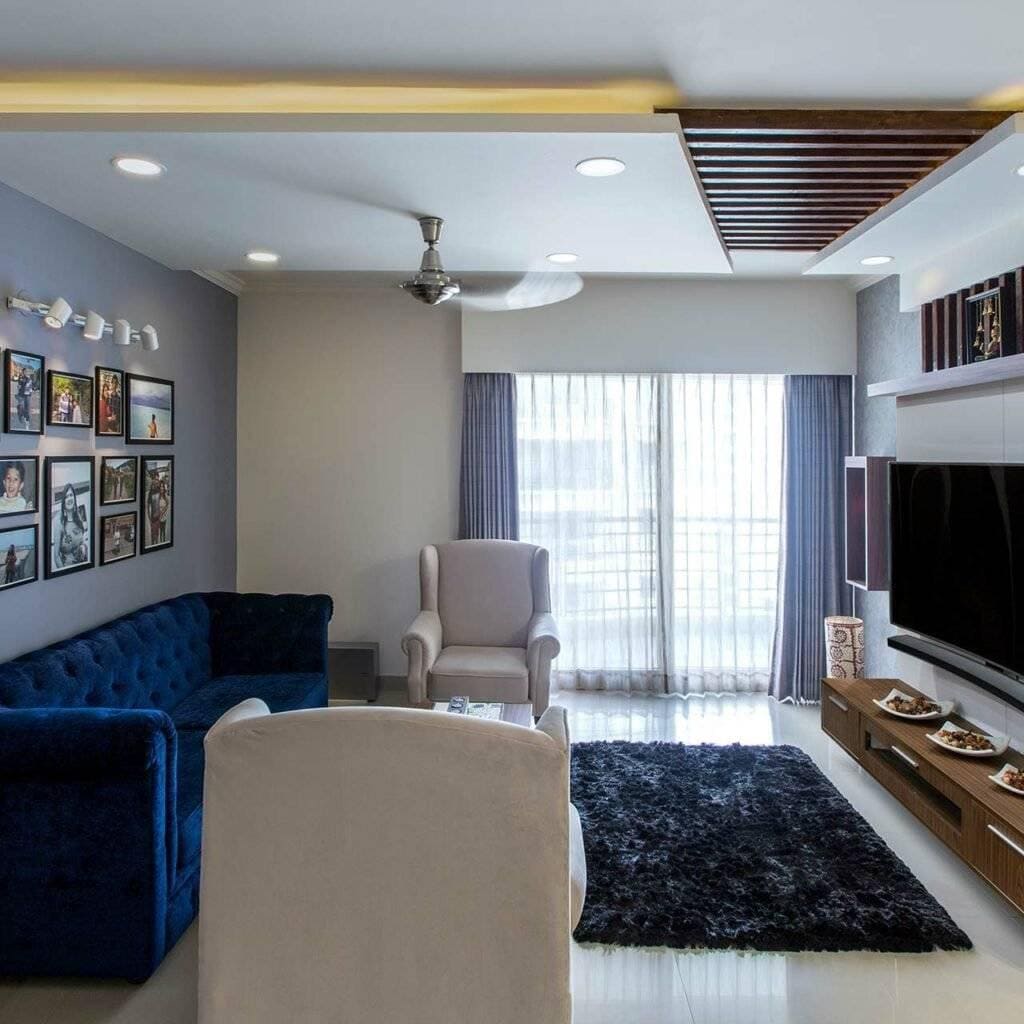 Top Furniture trends and styles of 2019 - Cobalt blue sofas contrast well with stalk white flooring and matching single seaters