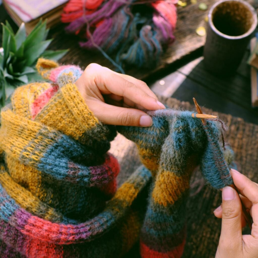 Warm rugs thrown over sofas, thick shaggy carpets, small tables in balcony for warm for indian balcony designs