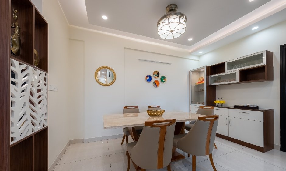 Dining area with crockery unit in a 3bhk interior house