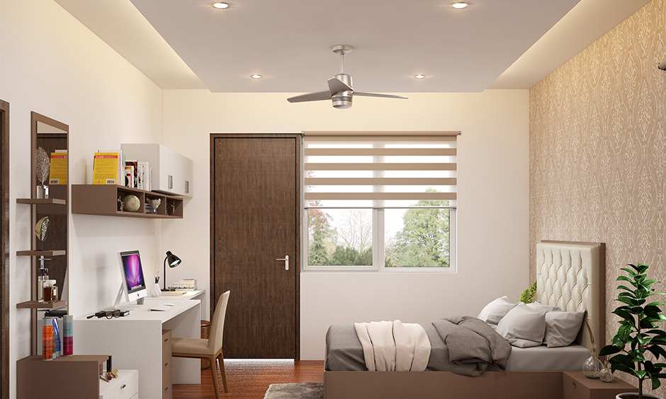 Rectangular bedroom with a functional false ceiling featuring recessed lighting, creating a cosy and inviting ambience.