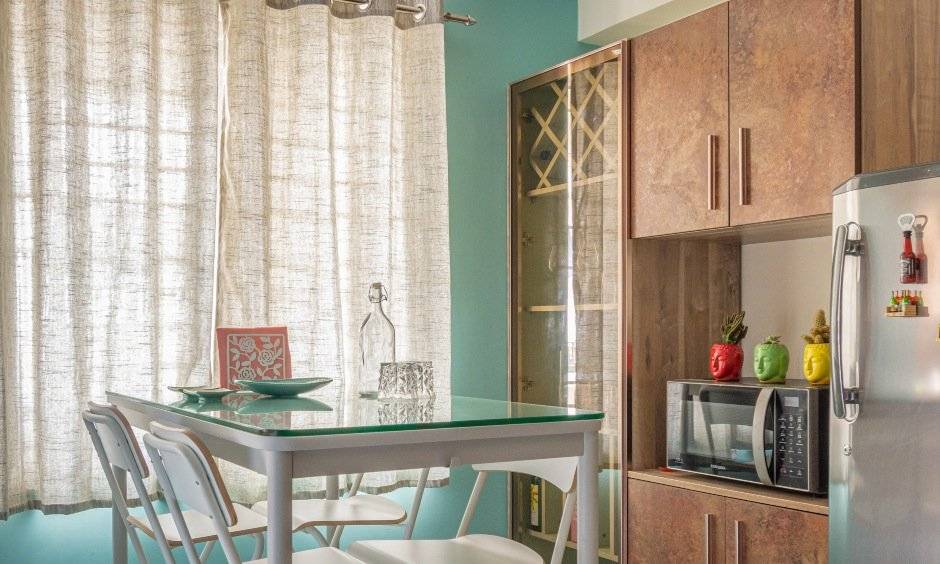 Glass dining room designed by cheap and best interior designers in hyderabad