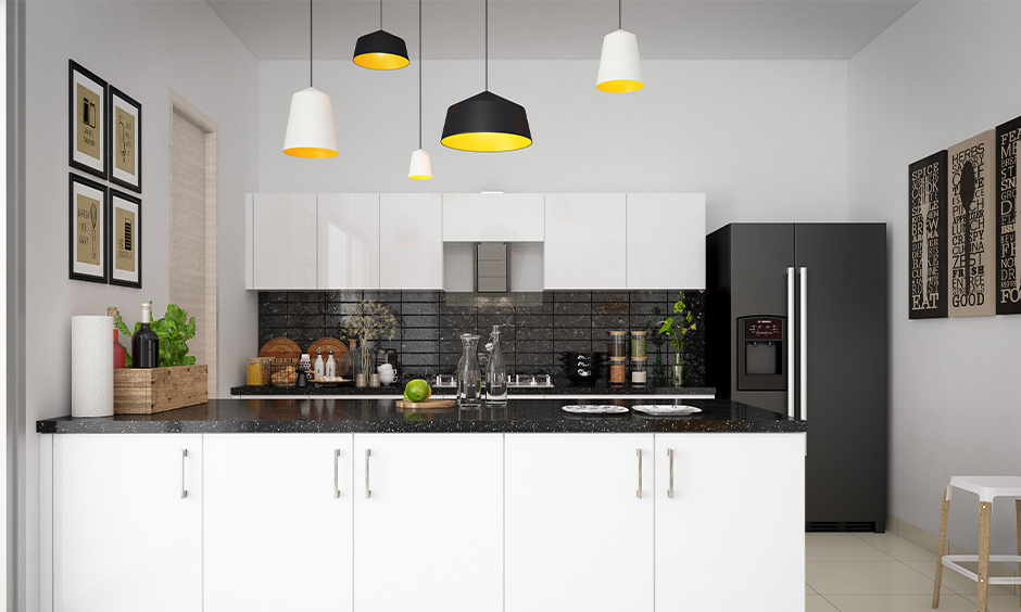 Kitchen with granite slabs used for both countertops and backsplashes, creating a seamless and luxurious look