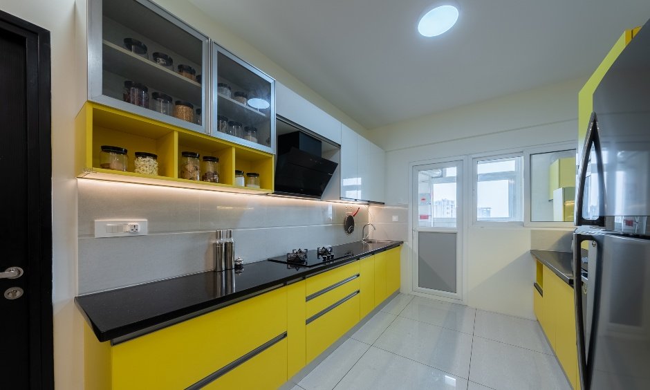 Modern 3bhk flat kitchen with grey and yellow color scheme