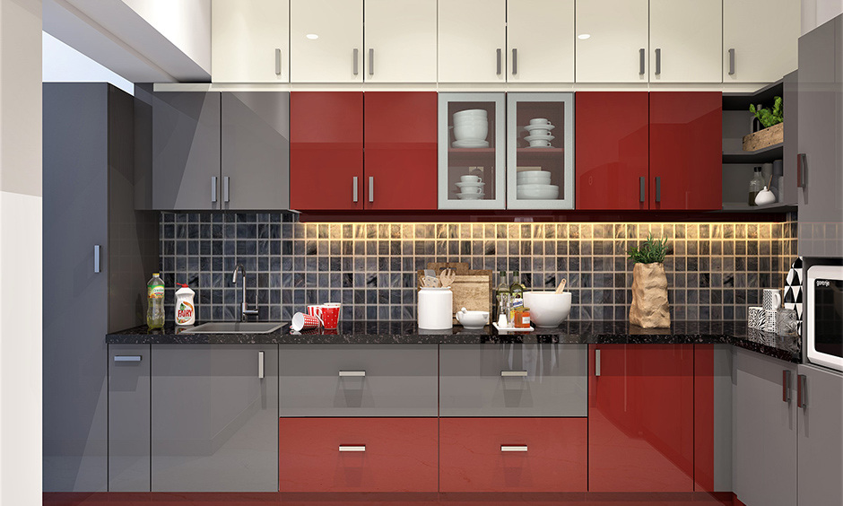 Elegant grey and white kitchen with refined red accents in decor and appliances for subtle charm.
