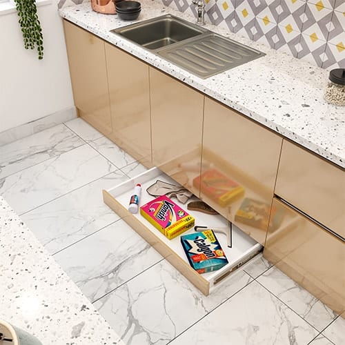 Home interior designer in Ahmedabad created a skirting drawer that utilizes the dead space