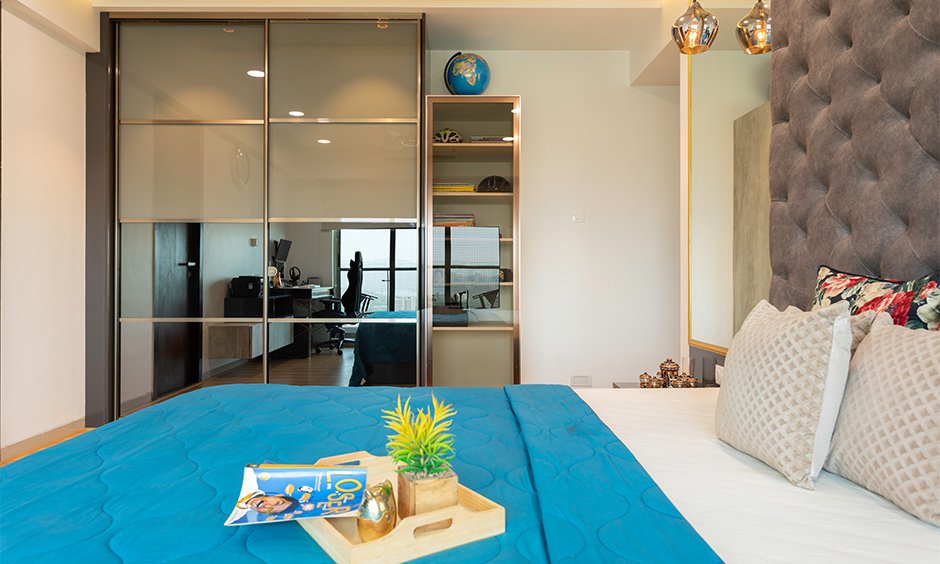 Interior contractor in mumbai with master bedroom is an airy and well-lit space designed with a floor-to-ceiling wardrobe
