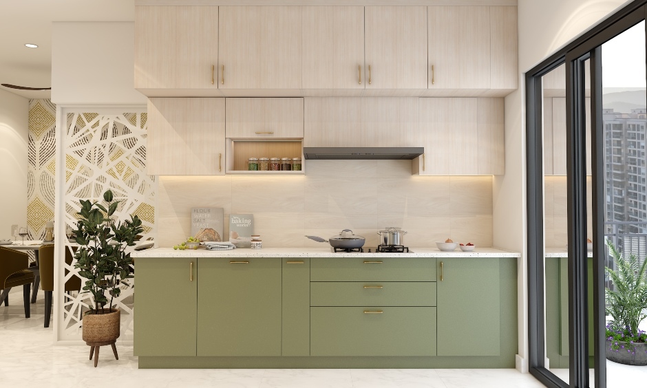 Sage green base cabinets, light-wood overhead cabinets, and gold accents create a calming kitchen furniture colour combination.