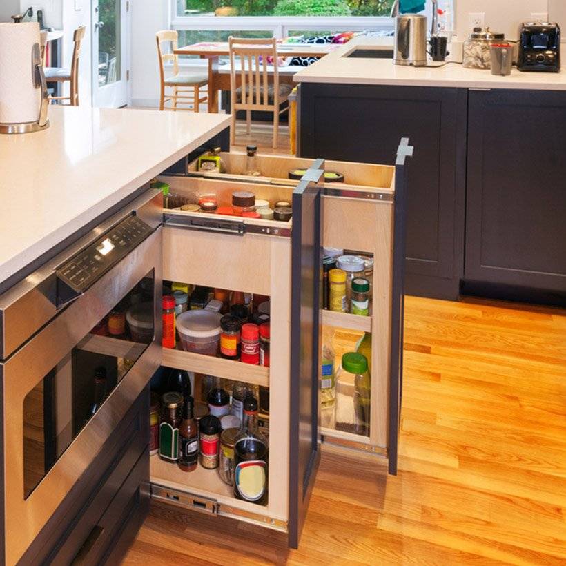 Pull-out drawers storing bottled ingredients are a great storage hack