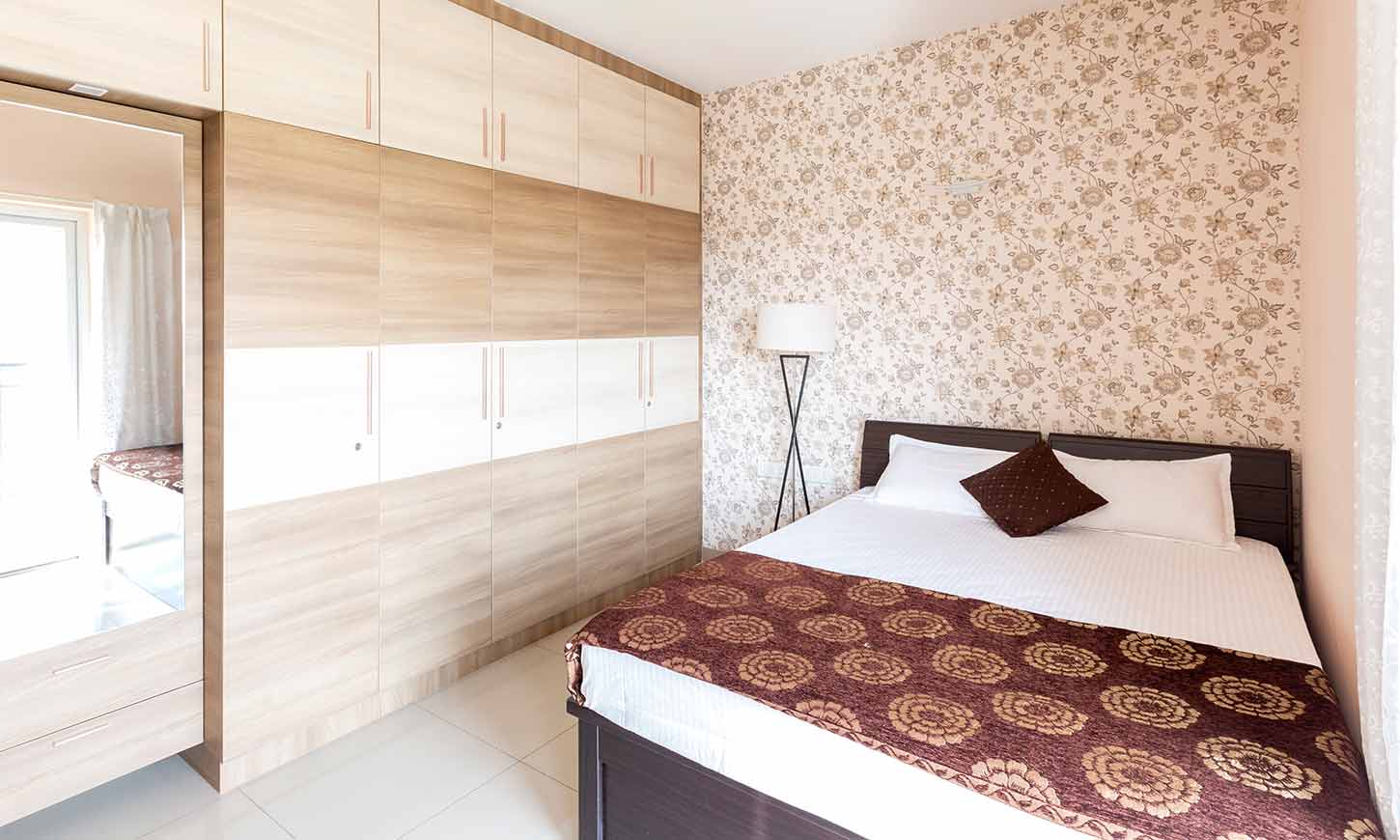 Bedroom with tv unit designed by leading interior designers in bangalore