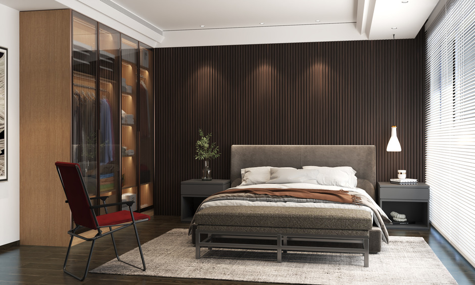 Metal folding chairs with armrests enhance a cosy reading nook by the bed, adding modern style and comfort.