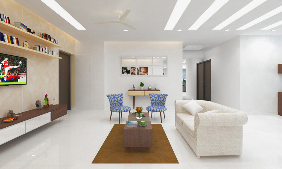 A minimalist living room design with a cosy white sofa and stylish blue-patterned chairs for a chic vibe