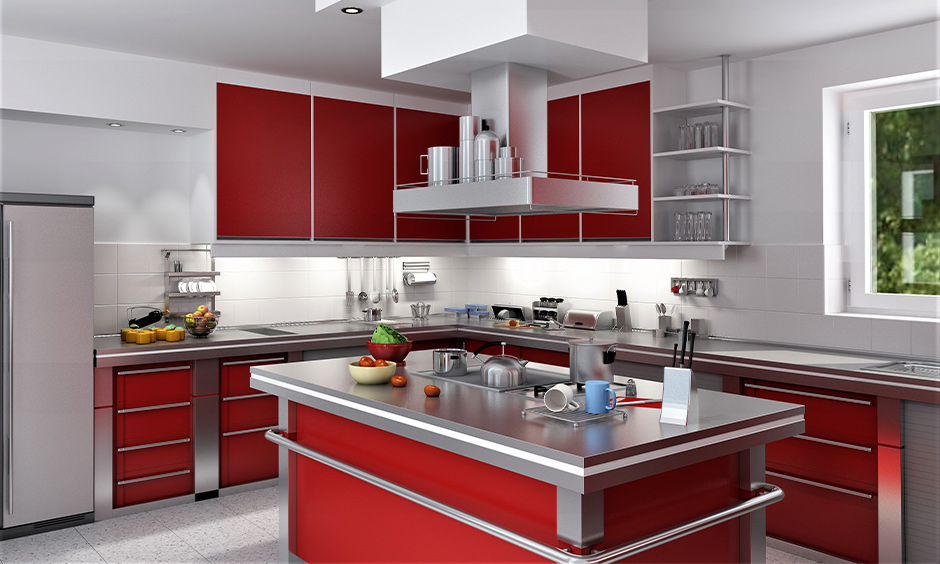 Modular kitchen in red and white with glossy cabinets, white counters, and sleek metallic accents