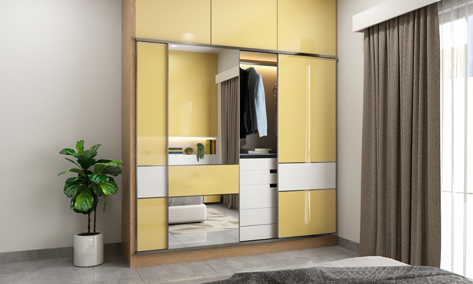The wall cabinet behind the bed and modular wardrobe provide additional storage space in a 2bhk house interior design