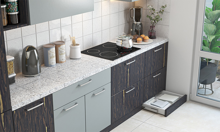 Kitchen with moon white granite slab, complementing wooden cabinets and metal accessories for a versatile and elegant design.