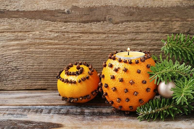DIY oranges garnished with cloves as DIY christmas decoration