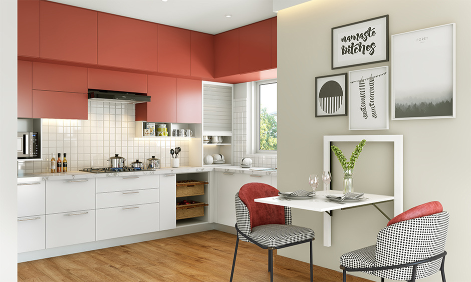 Stylish red and white kitchen furniture with a vibrant island and complementing bar stools for flair