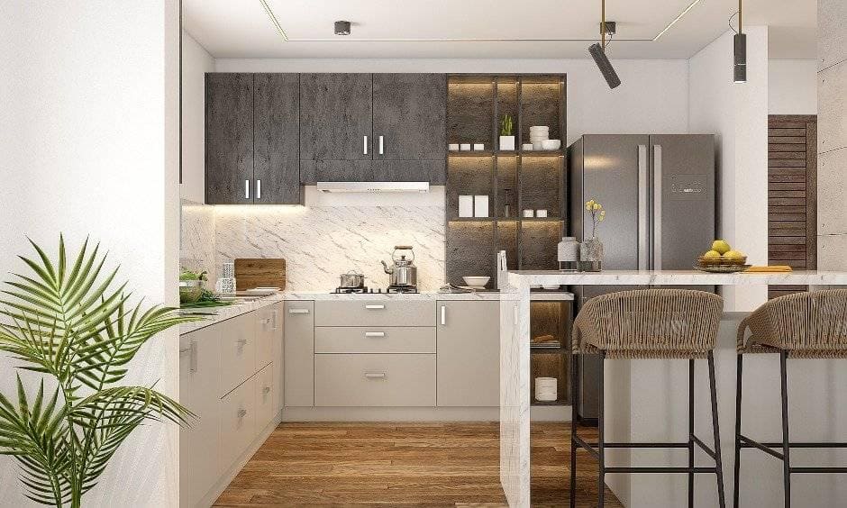 Small 1 bhk kitchen design with overhead cabinets and base cabinets to keep all kitchen essentials looks clutter-free.