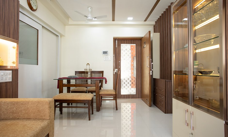 Living area with a rockery unit and storage cabinet designed by top 5 interior designers in mumbai