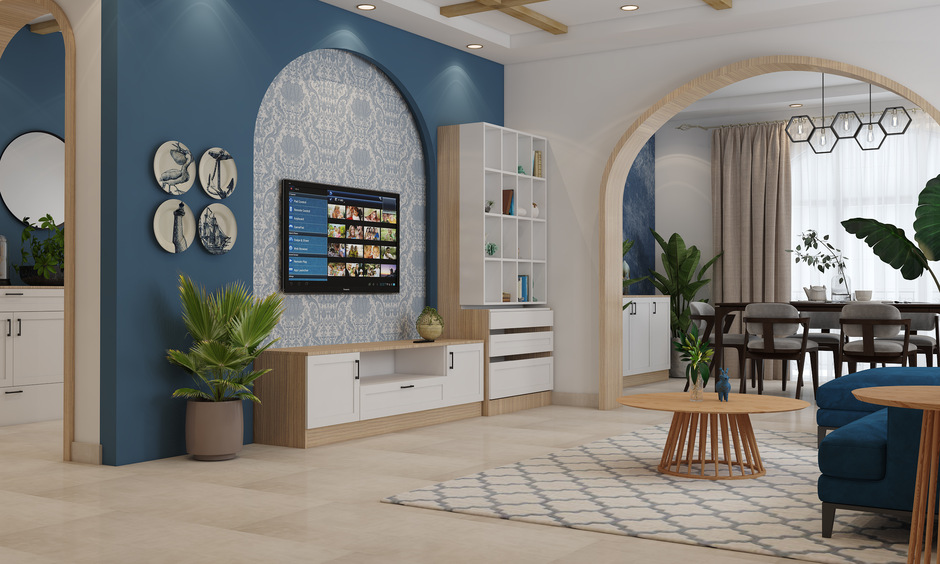 Cement-plastered wall with geometric patterns frames a cosy reading nook, showcasing trending interiors in Mumbai.