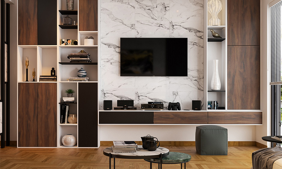 White marble TV unit with open shelves, cabinets, and drawers, paired with wooden furniture for a cosy, spacious look.
